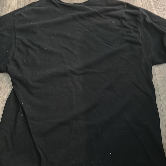 A black tee shirt from champion with a cool looking design - Picture 2 of 2